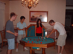 A group playing bumper pool