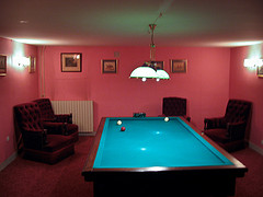 Billiards table and chairs in a private room