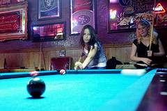 Ladies playing billiards