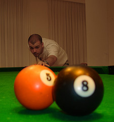 Man targetting two billiards balls